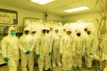 Photo of Franklin STEAM Academy students, teachers, and MRL staff during a tour of the MRL cleanroom on February 8, 2023. [Photo: Virgil Ward]